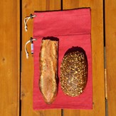 Sac à pain le pochon rouge avec demi baguette et pain nordique