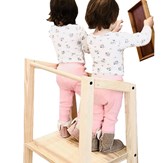 Deux enfants sur la tour d'observation montessori double en bois